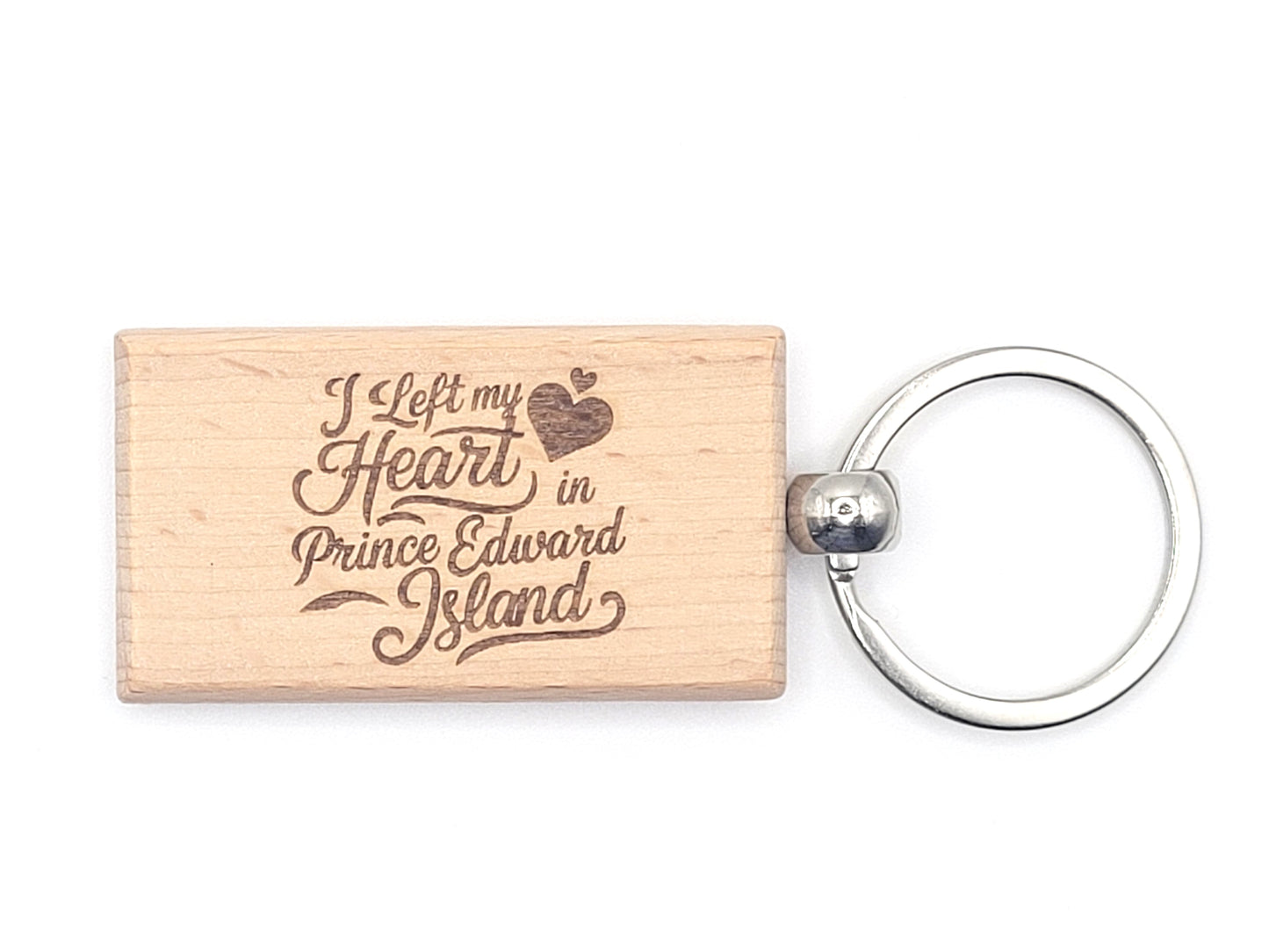 Wooden keychain with 'I Left my Heart in Prince Edward Island' text on a white background