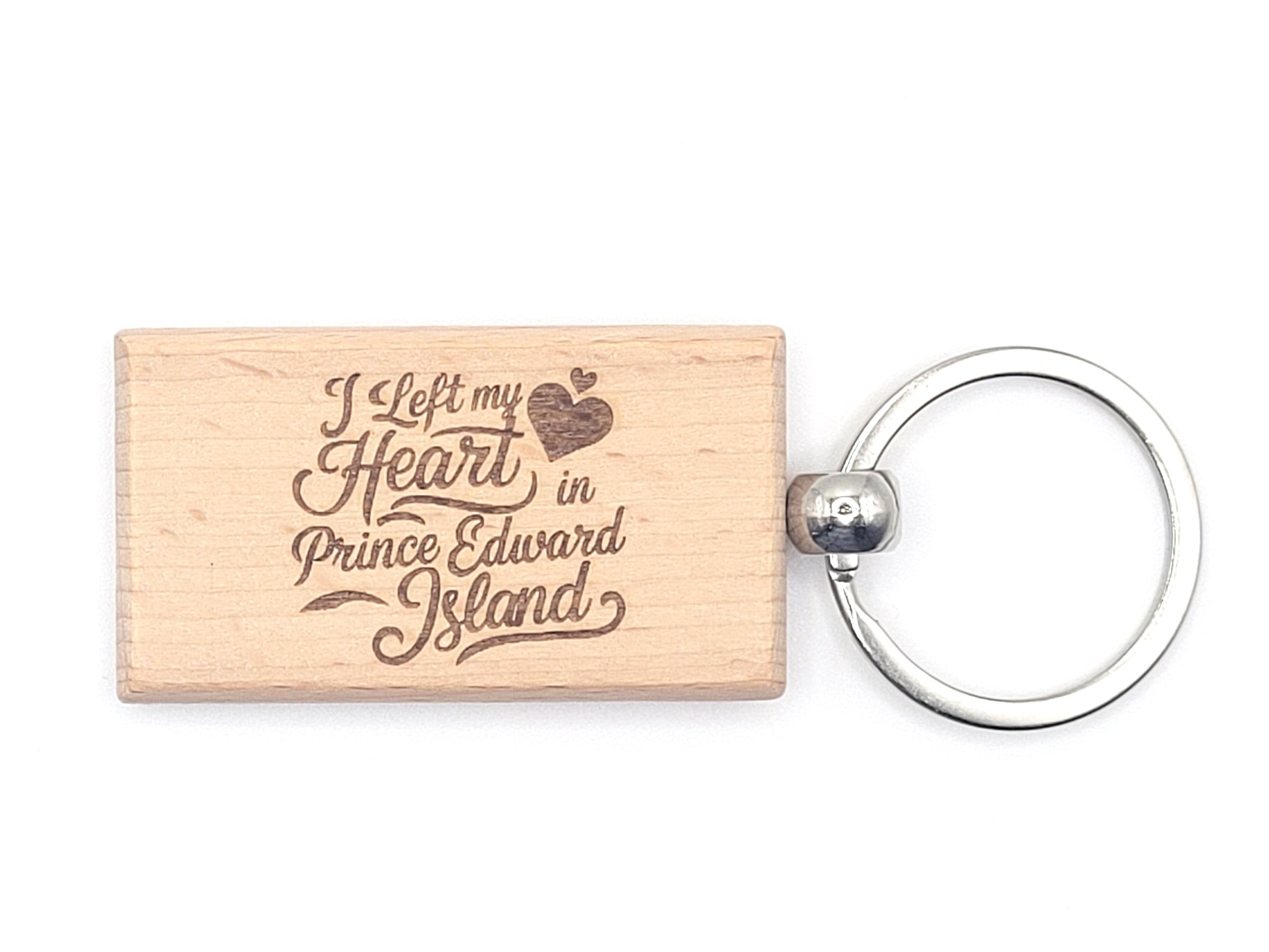 Wooden keychain with 'I Left my Heart in Prince Edward Island' text on a white background