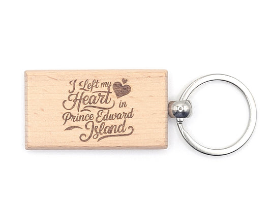 Wooden keychain with 'I Left my Heart in Prince Edward Island' text on a white background